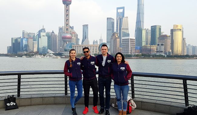 The MBA students team in front of the Shanghai skyline