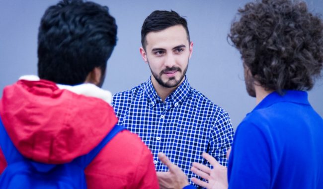 three people discussing