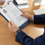 Human,Resources,Manager,Reading,Applicant&rsquo;s,Resume,In,Office,,Closeup